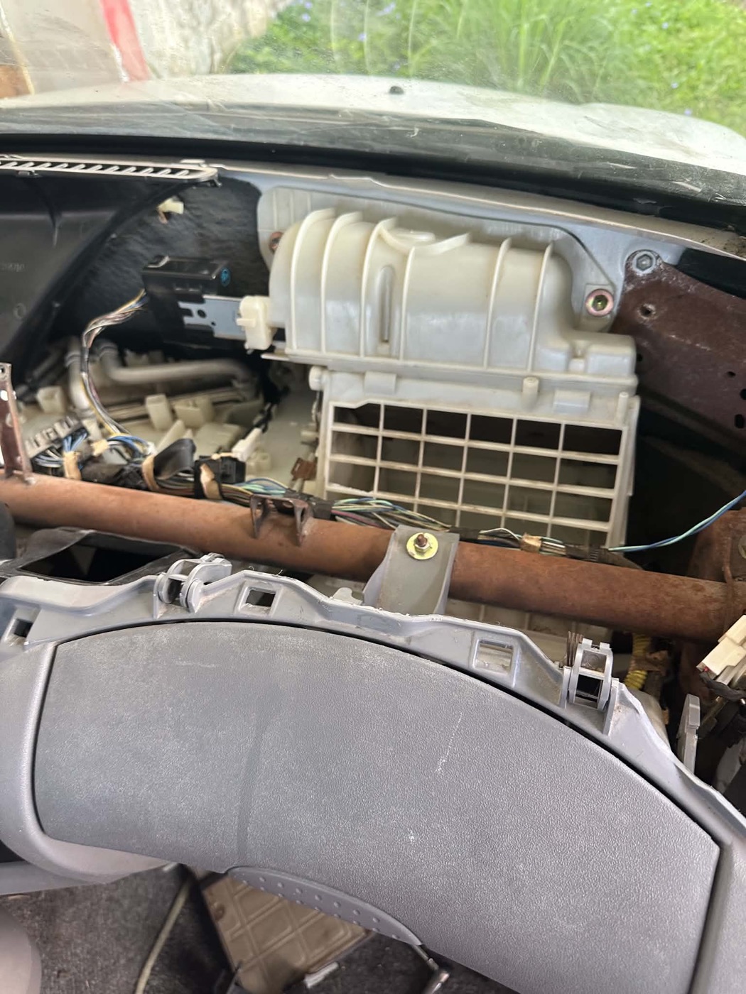 Car dashboard removed to expose the A/C blower and evaporator housing